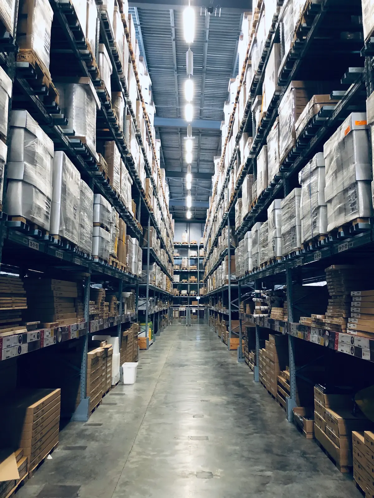 A warehouse aisle stocked with boxed inventory